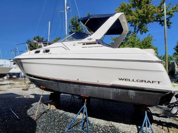 Slide: The Image of 1997 Wellcraft 2800 Martinique boat on stands, ready for maintenance. - 1