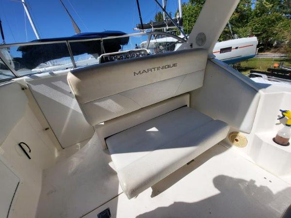 Slide: The Image of 1997 Wellcraft 2800 Martinique boat interior with white seating and dashboard. - 12