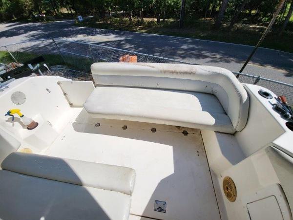 Slide: The Image of 1997 Wellcraft 2800 Martinique boat interior with white seating and deck. - 14