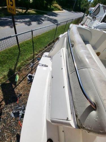 Slide: The Image of 1997 Wellcraft 2800 Martinique boat interior with seating and storage compartments. - 15