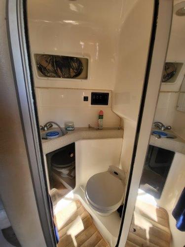 Slide: The Image of 1997 Wellcraft 2800 Martinique boat bathroom with sink and toilet - 23