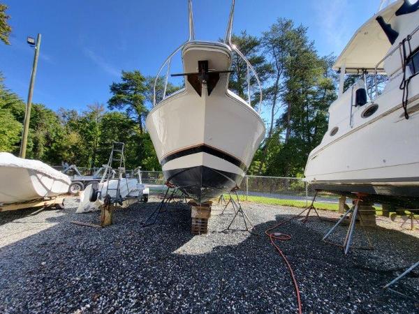 Slide: The Image of 1997 Wellcraft 2800 Martinique boat on dry dock for maintenance. - 24