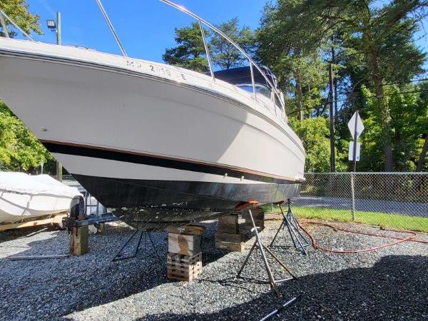 Slide: The Image of 1997 Wellcraft 2800 Martinique boat on stands for maintenance. - 25