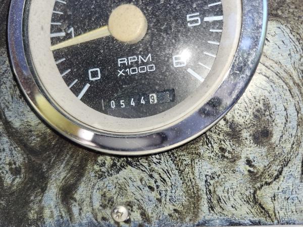Slide: The Image of Close-up of 1997 Wellcraft 2800 Martinique RPM gauge showing 5449 hours. - 5