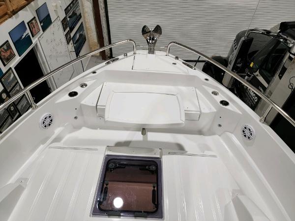 Slide: The Image of 2024 Wellcraft 355 Commuter boat deck with stainless steel railings and hatch. - 18