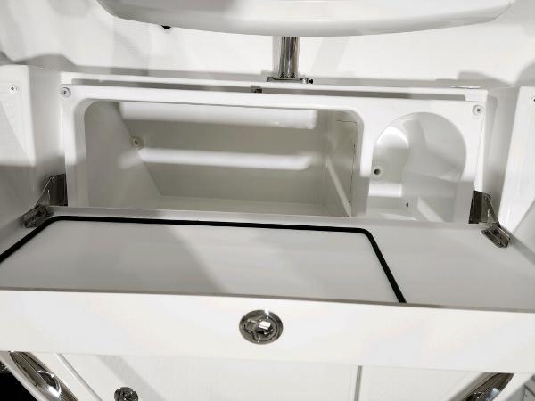 Slide: The Image of 2024 Wellcraft 355 Commuter storage compartment with open hatch. - 22