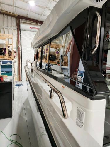 Slide: The Image of 2024 Wellcraft 355 Commuter boat in a storage facility. - 26
