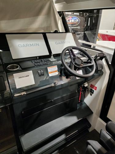 Slide: The Image of 2024 Wellcraft 355 Commuter helm with Garmin navigation displays. - 33