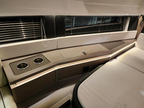 Slide: The Image of 2024 Wellcraft 355 Commuter interior cabin with modern seating and cup holders. - 43