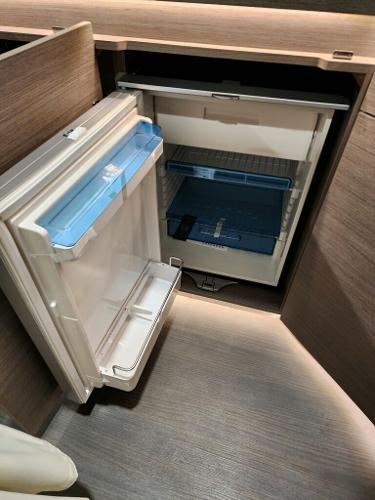 Slide: The Image of 2024 Wellcraft 355 Commuter boat interior fridge compartment. - 49