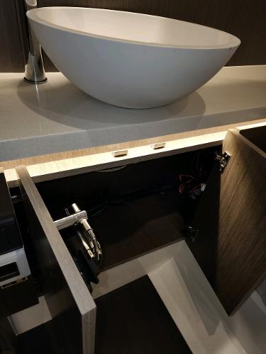 Slide: The Image of Modern sink and open cabinet in 2024 Wellcraft 355 Commuter boat. - 7