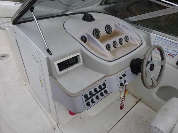 Slide: The Image of 1996 Wellcraft 2400S ECLIPSE boat dashboard with steering wheel and control panel. - 12