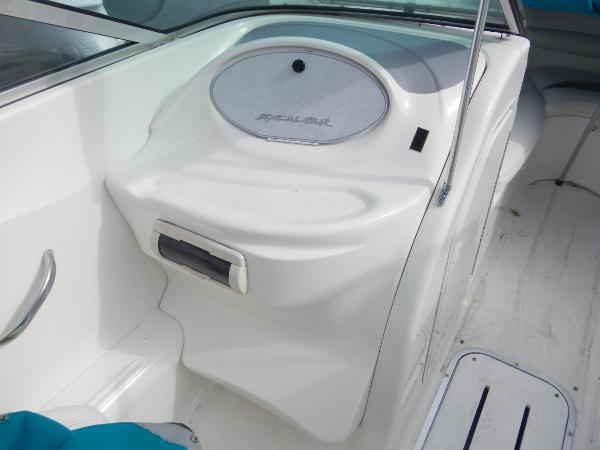 Slide: The Image of 2000 Wellcraft EXCALIBUR boat interior, white console with storage compartment. - 14