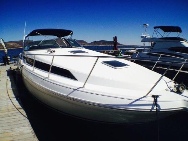 Slide: The Image of 1995 Wellcraft 3600 Martinique yacht docked at marina under clear blue sky. - 16
