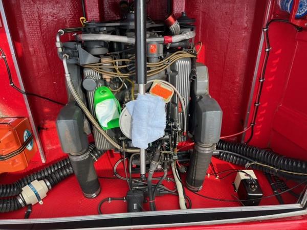 Slide: The Image of 1987 Wellcraft Nova Spyder 26 engine compartment with visible components and wiring. - 10