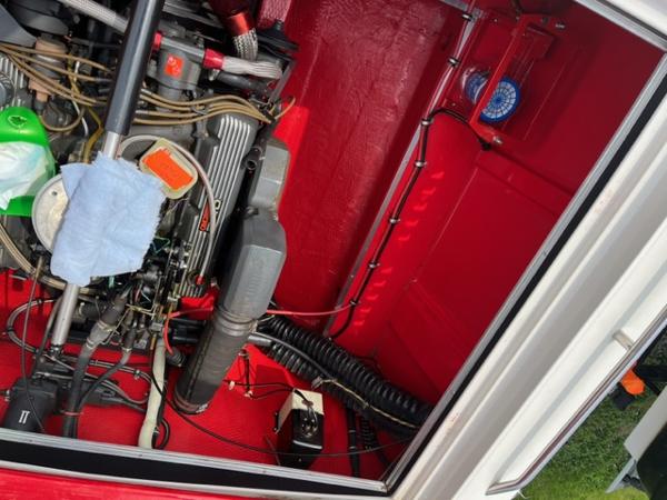 Slide: The Image of Engine compartment of a 1987 Wellcraft Nova Spyder 26 boat with red interior. - 12
