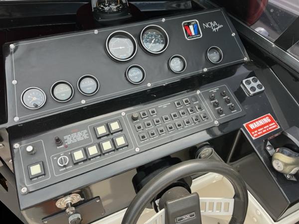 Slide: The Image of 1987 Wellcraft Nova Spyder 26 dashboard with gauges and control panel. - 16