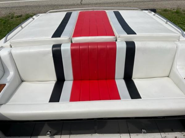 Slide: The Image of 1987 Wellcraft Nova Spyder 26 boat seat with red, black, and white upholstery. - 9