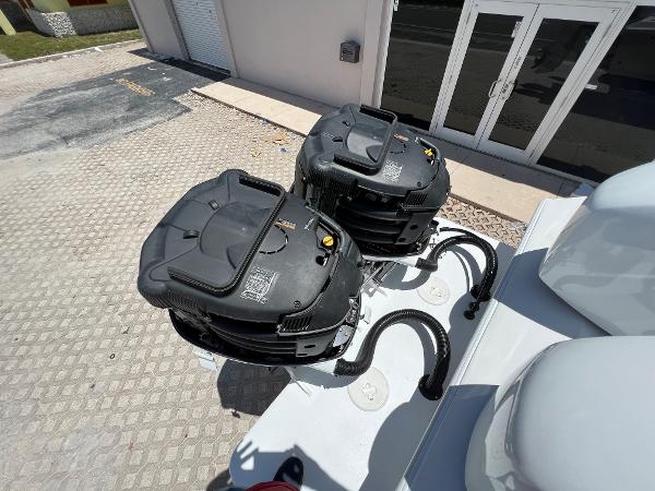 Slide: The Image of 1979 Wellcraft Scarab Sport 302 boat engines in a parking lot. - 39