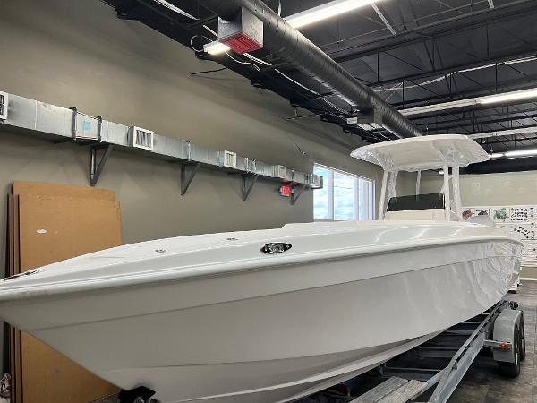 Slide: The Image of 1979 Wellcraft Scarab Sport 302 boat in a modern indoor facility. - 40