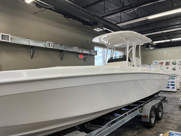 Slide: The Image of 1979 Wellcraft Scarab Sport 302 boat on a trailer in a garage. - 41