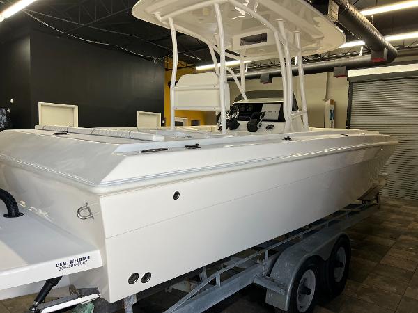 Slide: The Image of 1979 Wellcraft Scarab Sport 302 boat on trailer in indoor storage. - 45