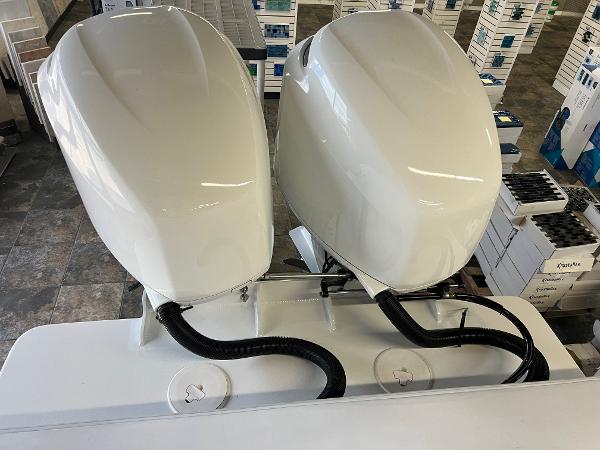 Slide: The Image of Twin outboard engines on a 1979 Wellcraft Scarab Sport 302 boat. - 48
