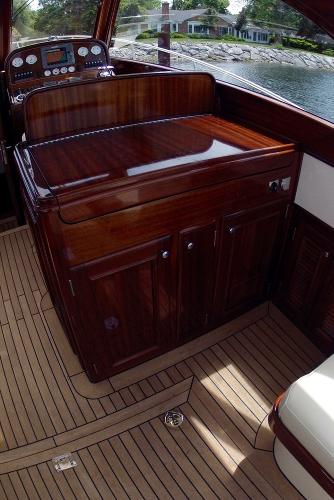 Slide: The Image of Luxurious interior of 2009 Windsor Craft 36 Hard Top boat with polished wooden cabinetry. - 29