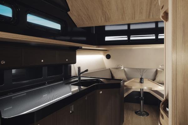 Slide: The Image of 2024 Windy SRL/SR60 yacht interior with modern kitchen and cozy dining area. - 6