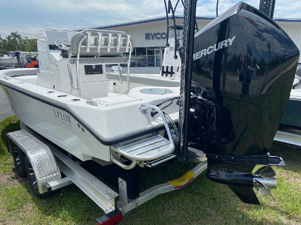 Slide: The Image of 2023 Xplor x24 Andros boat with Mercury engine on trailer. - 12