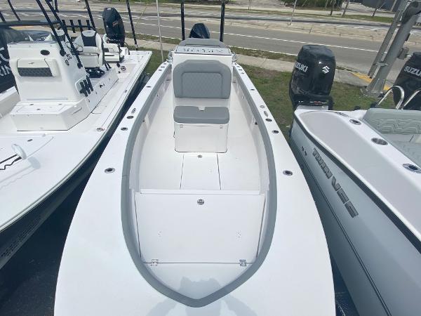 Slide: The Image of 2023 Xplor x24 Andros boat, white, center console, docked with other boats. - 14