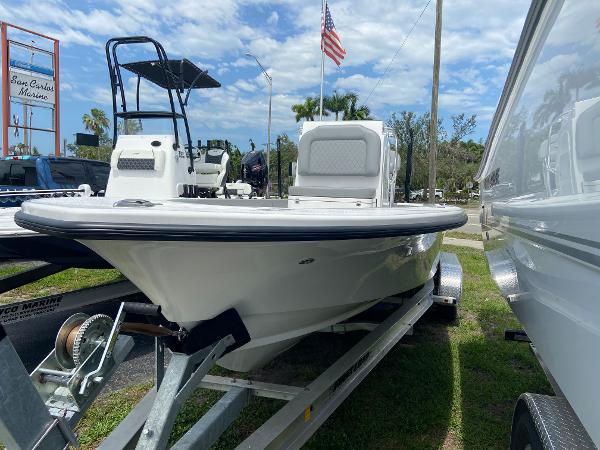 Slide: The Image of 2023 Xplor x24 Andros boat on trailer, displayed outdoors. - 2