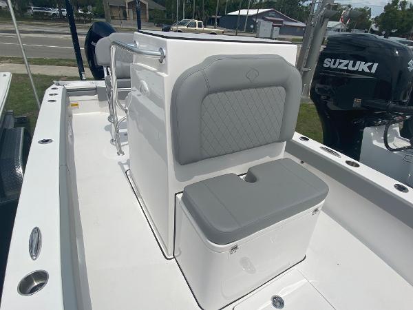 Slide: The Image of 2023 Xplor x24 Andros boat interior with gray cushioned seating and Suzuki outboard motor. - 5