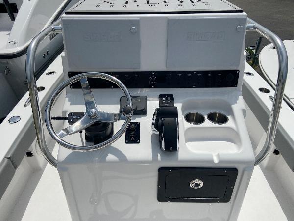 Slide: The Image of 2023 Xplor x24 Andros boat console with steering wheel and controls. - 7