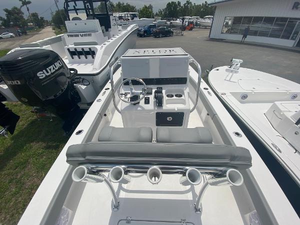 Slide: The Image of 2023 Xplor x24 Andros boat interior with Suzuki engine, docked at a dealership. - 8