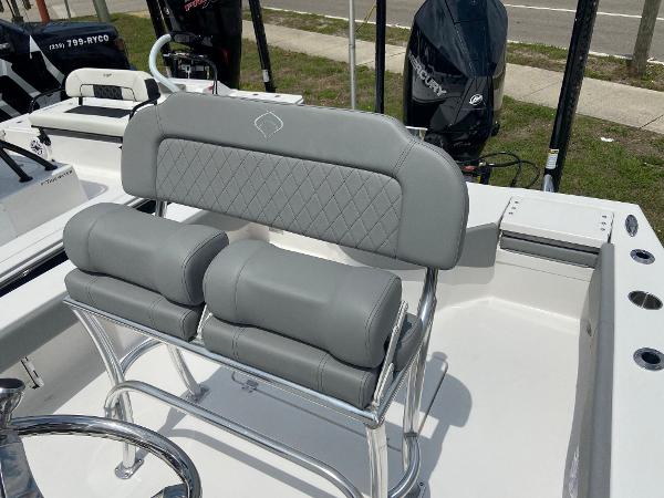 Slide: The Image of 2023 Xplor x24 Andros boat with gray cushioned seating and stainless steel frame. - 9