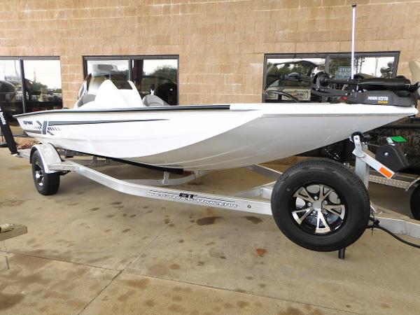 Slide: The Image of 2023 Xpress H17 boat on a trailer, displayed outdoors. - 1