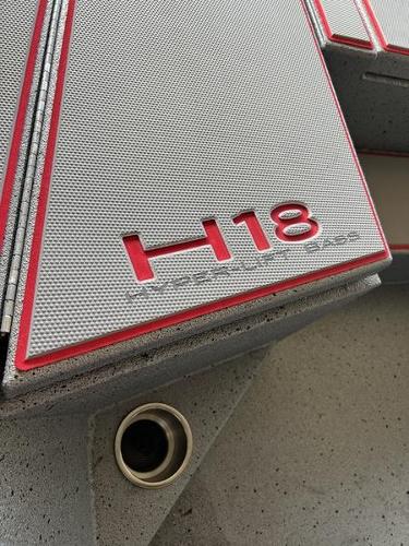 Slide: The Image of 2023 Xpress H18 boat deck with red trim and H18 logo. - 4