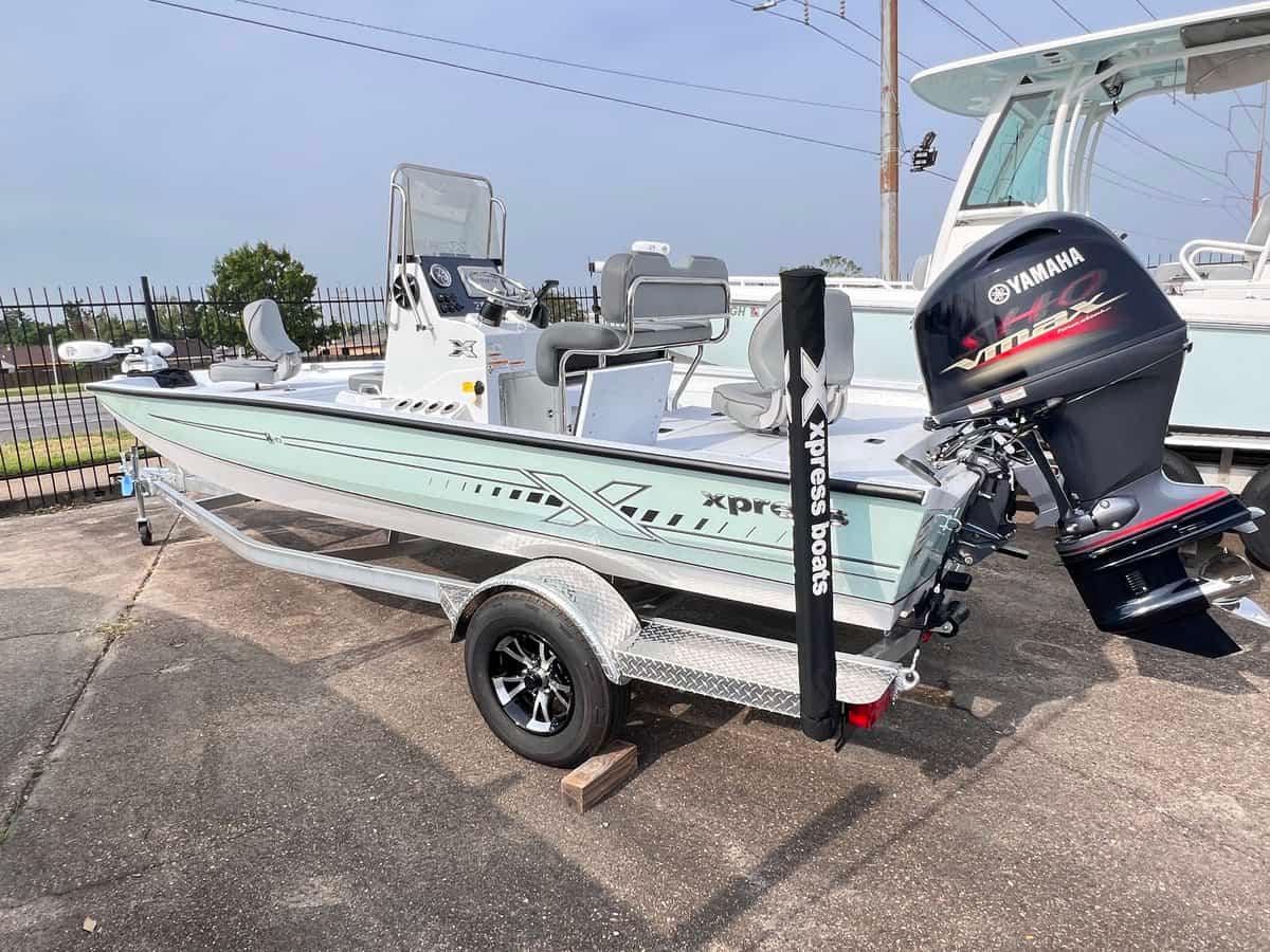 Slide: The Image of 2024 Xpress H20B Hyper-Lift Bay boat with Yamaha VMAX engine on trailer. - 12