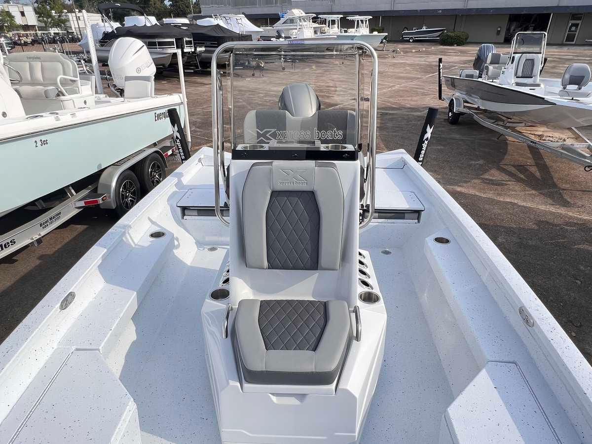 Slide: The Image of 2024 Xpress H20B Hyper-Lift Bay boat interior at a dealership. - 6
