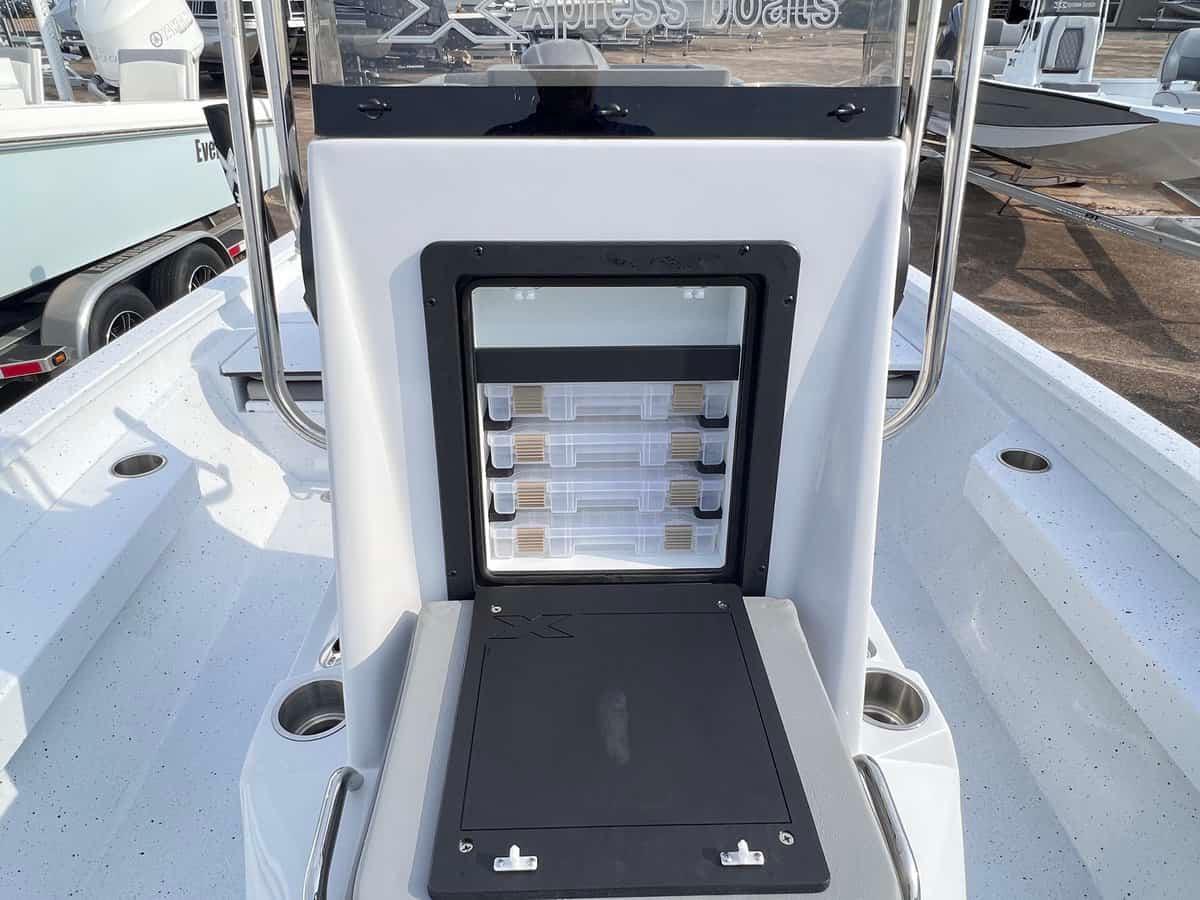 Slide: The Image of 2024 Xpress H20B Hyper-Lift Bay boat with storage compartments and rod holders. - 7