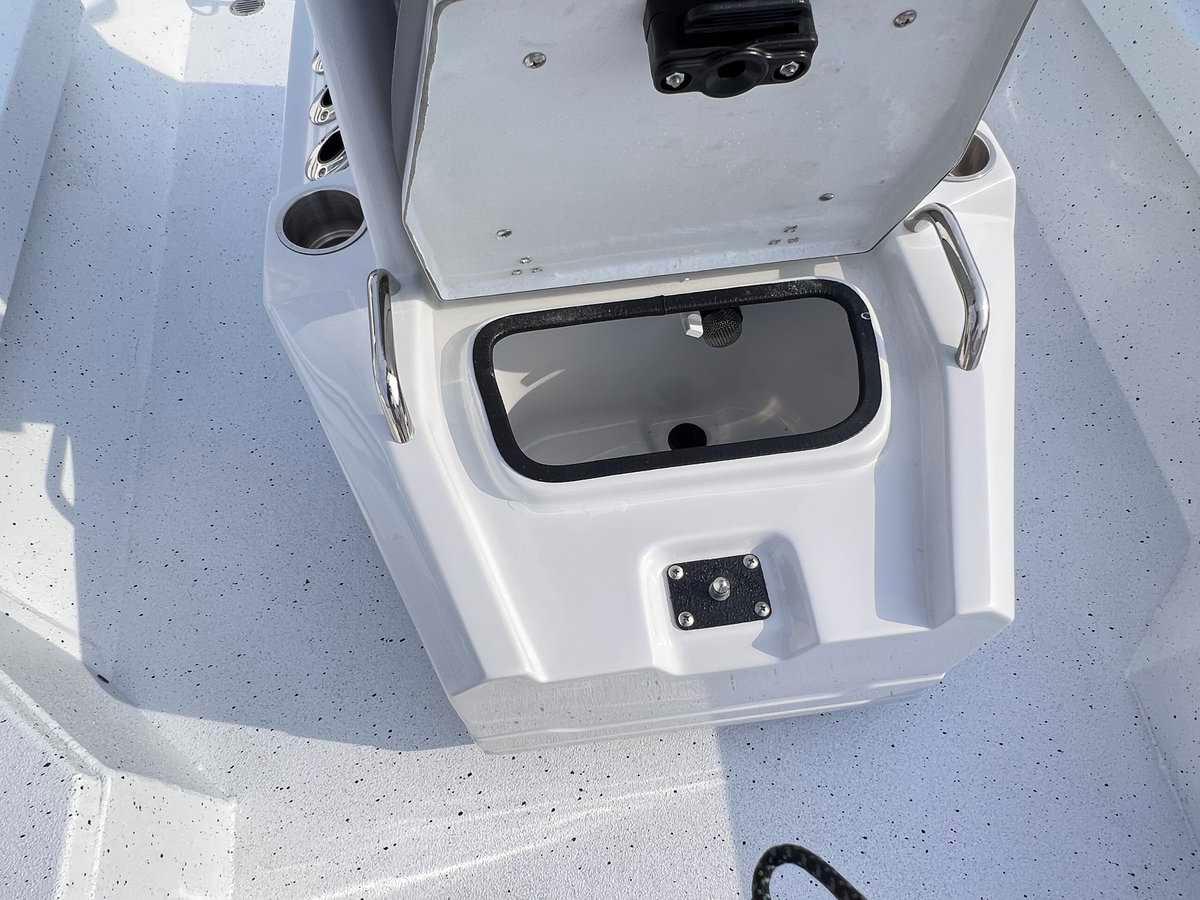 Slide: The Image of 2024 Xpress H20B Hyper-Lift Bay boat storage compartment with open lid. - 8