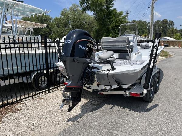 Slide: The Image of 2025 Xpress H22B boat with Yamaha 175 engine on trailer, parked outdoors. - 3