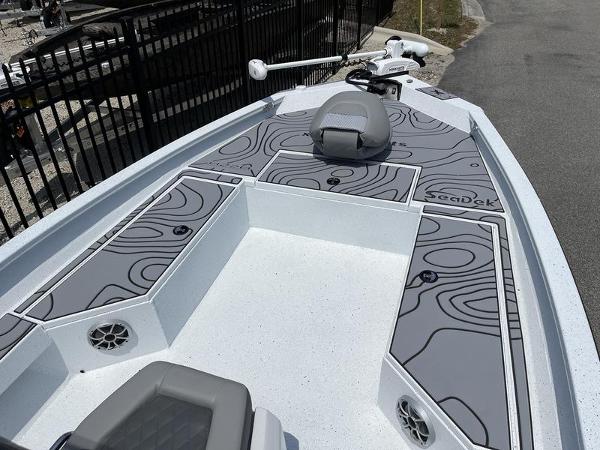 Slide: The Image of 2025 Xpress H22B boat deck with custom SeaDek flooring, featuring sleek design and modern amenities. - 4