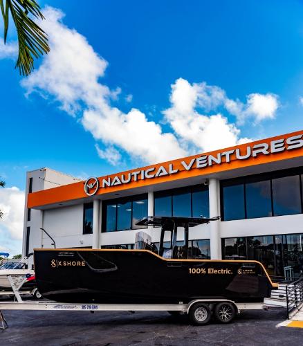 Slide: The Image of 2023 X Shore Eelex 8000 electric boat outside Nautical Ventures dealership. - 1