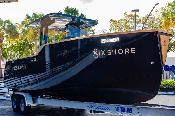 Slide: The Image of 2023 X Shore Eelex 8000 electric boat on trailer, side view. - 15