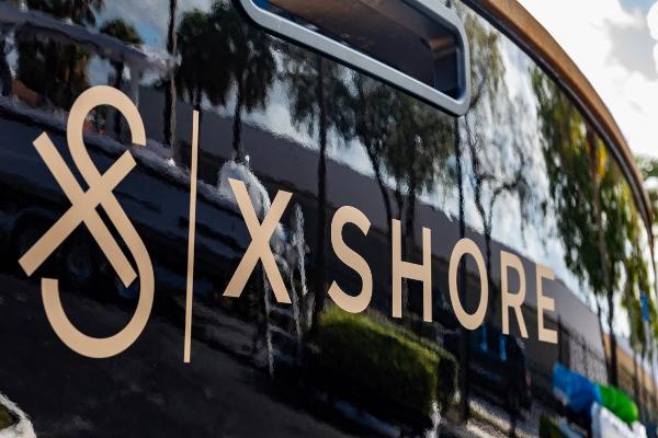 Slide: The Image of X Shore Eelex 8000 2023 logo on a sleek black surface. - 17