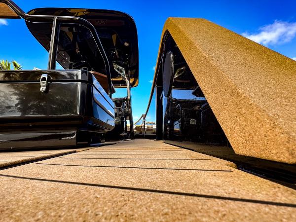 Slide: The Image of 2023 X Shore Eelex 8000 electric boat docked under a clear blue sky. - 9