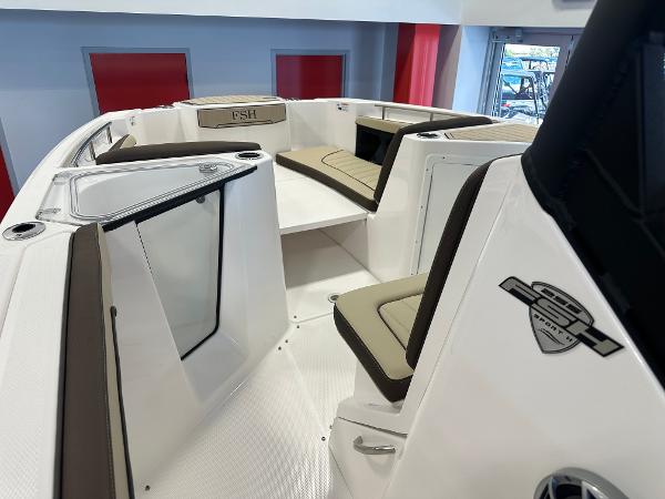 Slide: The Image of 2024 Yamaha Boats 255 FSH Sport H interior with seating and storage. - 14