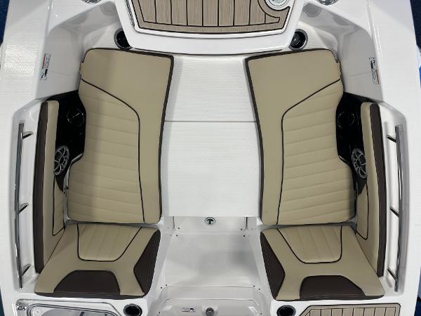 Slide: The Image of 2024 Yamaha Boats 255 FSH Sport H interior seating, beige and brown upholstery. - 18